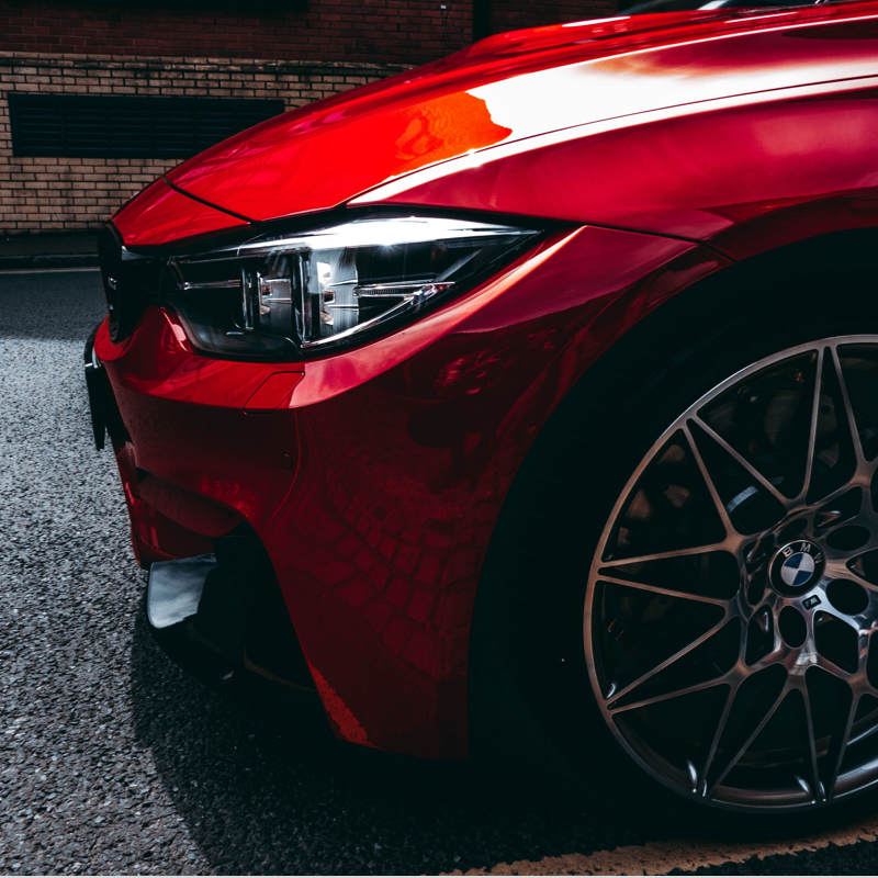 side profile of front-end of a red bmw car